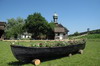 Roumanie - Delta du Danube - Barque fleurie devant le monastÚre Saint Atanasie